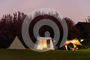 holiday outdoor camping : tourist tent camping in mountains, family vacation picnic on holiday relax, overview of camping of