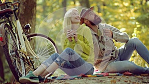 Holiday outdoor vacation trip. Happy young cople in park on sunny autumn day. Romantic Autumn Couple in Love. Enjoy.