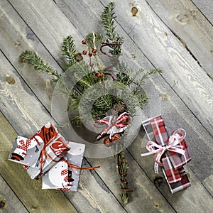 Holiday package decoration with branch and bells