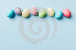 holiday preparation Multi colors Easter eggs on colored background . Pastel color Easter eggs. holiday concept with copy