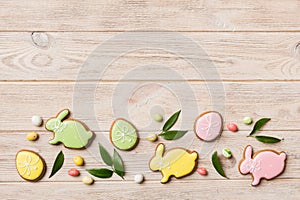 holiday preparation Multi colors Easter eggs with cookies on colored background . Pastel color Easter eggs. holiday