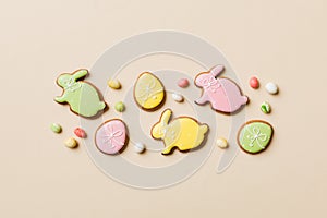 holiday preparation Multi colors Easter eggs with cookies on colored background . Pastel color Easter eggs. holiday