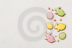 holiday preparation Multi colors Easter eggs with cookies on colored background . Pastel color Easter eggs. holiday