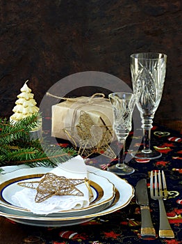 Holiday rustic Christmas and New Year table setting with xmas decorations at dark wooden table. Selective focus,