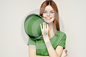 Holiday Saint Patrick`s Day shamrock girl fun Green clothing light background