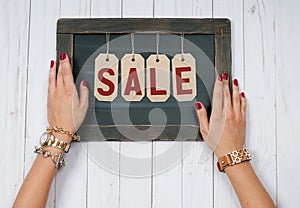 Holiday Sale. Female hands with jewelry. Fashion accessories