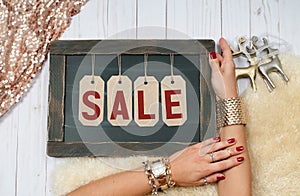 Holiday Sale. Female hands with jewelry. Fashion accessories