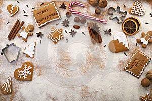 Holiday season sweets - gingerbread cookies with ingredients on the table - copy space