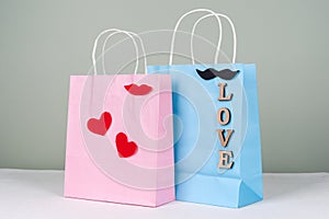 Holiday shopping, gifts. Shopping bags with love letters and hearts