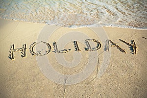 Holiday sign on the beach of Caribbean Sea