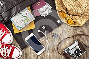 Holiday suitcase on wooden table