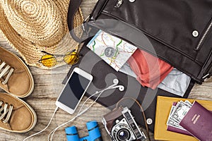 Holiday suitcase on wooden table