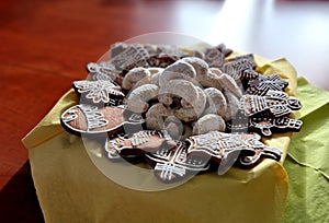 holiday table with gingerbread sweets and vanilla rolls. everything is