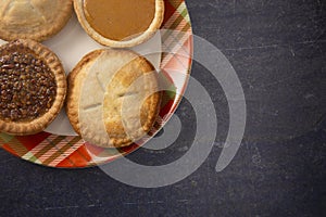 Holiday Table Set with Various Flavors of Fresh Baked Pies