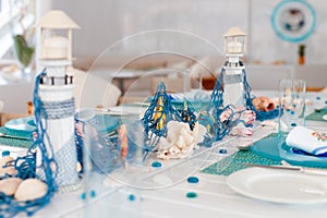 Holiday table setting with blue linens and blue thread decor