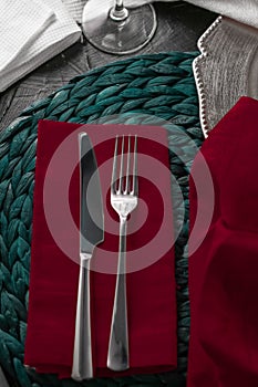 Holiday table setting with red napkin and silver cutlery, food styling props, vintage set for wedding, event, date, party or