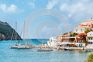 Holiday vacation in beautiful Assos village located in hidden cove on sunny summer day, Kefalonia island, Greece