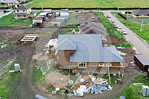 Holiday village, view from above. House with a new roof made of