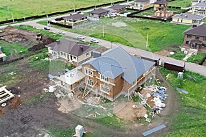 Holiday village, view from above. House with a new roof made of