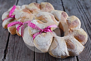 Holiday wholegrain bread wreath tied with a ribbon