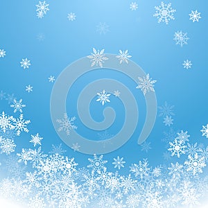 Holiday winter background for Merry Christmas and Happy New Year. Falling white snowflakes on blue background. Winter blue sky