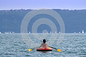 Holiday woman rows boat