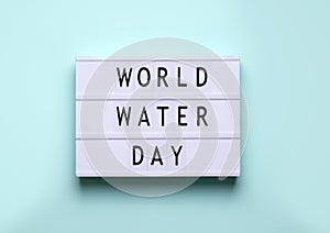 Holiday world water day. lightbox inscription on blue background.