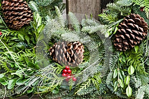 Holiday wreath of evergreens and cones