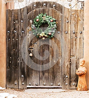 Holiday Wreath on a Wooden Entryway in Santa Fe, New Mexico