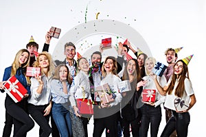 Holiday. Young beautiful people having fun on a white background.