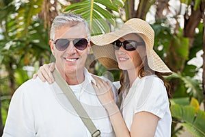 Holidaying couple smiling at camera