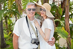 Holidaying couple smiling at camera