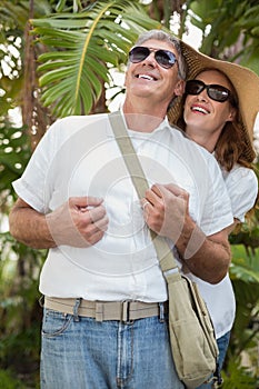 Holidaying couple smiling and looking up