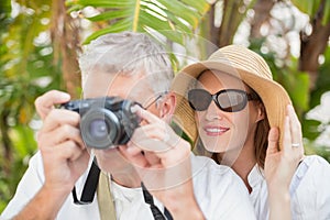 Holidaying couple taking a photo