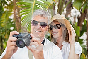 Holidaying couple taking a photo