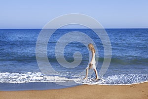 Holidaymaker with feet in wate