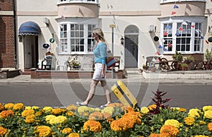 Holidaymaker walking with yellow suitcase