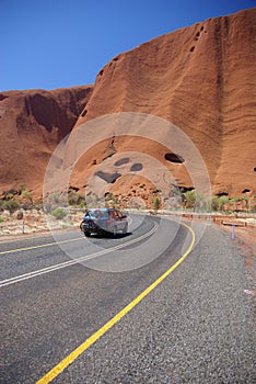 Holidaymakers On Road to Uluru