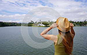 Holidays in Brazil. Young tourist woman on Pampulha Lake in Belo Horizonte, UNESCO World Heritage Site, Minas Gerais, Brazil photo