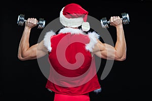 Holidays and celebrations, New year, Christmas, sports, bodybuilding, healthy lifestyle - Muscular handsome Santa Claus