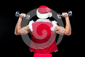 Holidays and celebrations, New year, Christmas, sports, bodybuilding, healthy lifestyle - Muscular handsome Santa Claus