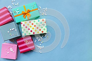 Holidays giftboxes on the pastel blue background