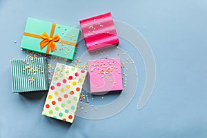 Holidays giftboxes on the pastel mint background for