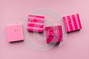 Holidays giftboxes on the pastel pink background