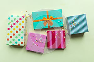 Holidays giftboxes on the pastel yellow background