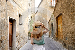 Holidays in Italy. Young woman visiting historic medieval town of Orvieto, Umbria, Italy