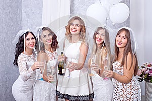 Holidays, nightlife, bachelorette party and people concept - smiling women with champagne glasses