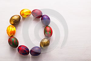 Holidays, traditions and Easter concept - Multi-colored decorative colourful eggs on white background with copy space