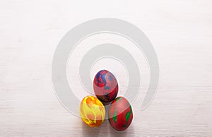 Holidays, traditions and Easter concept - Multi-colored decorative colourful eggs on white background with copy space