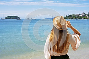 Holidays on tropical island. Traveler girl on Jurere beach, Florianopolis Santa Catarina Island, Brazil